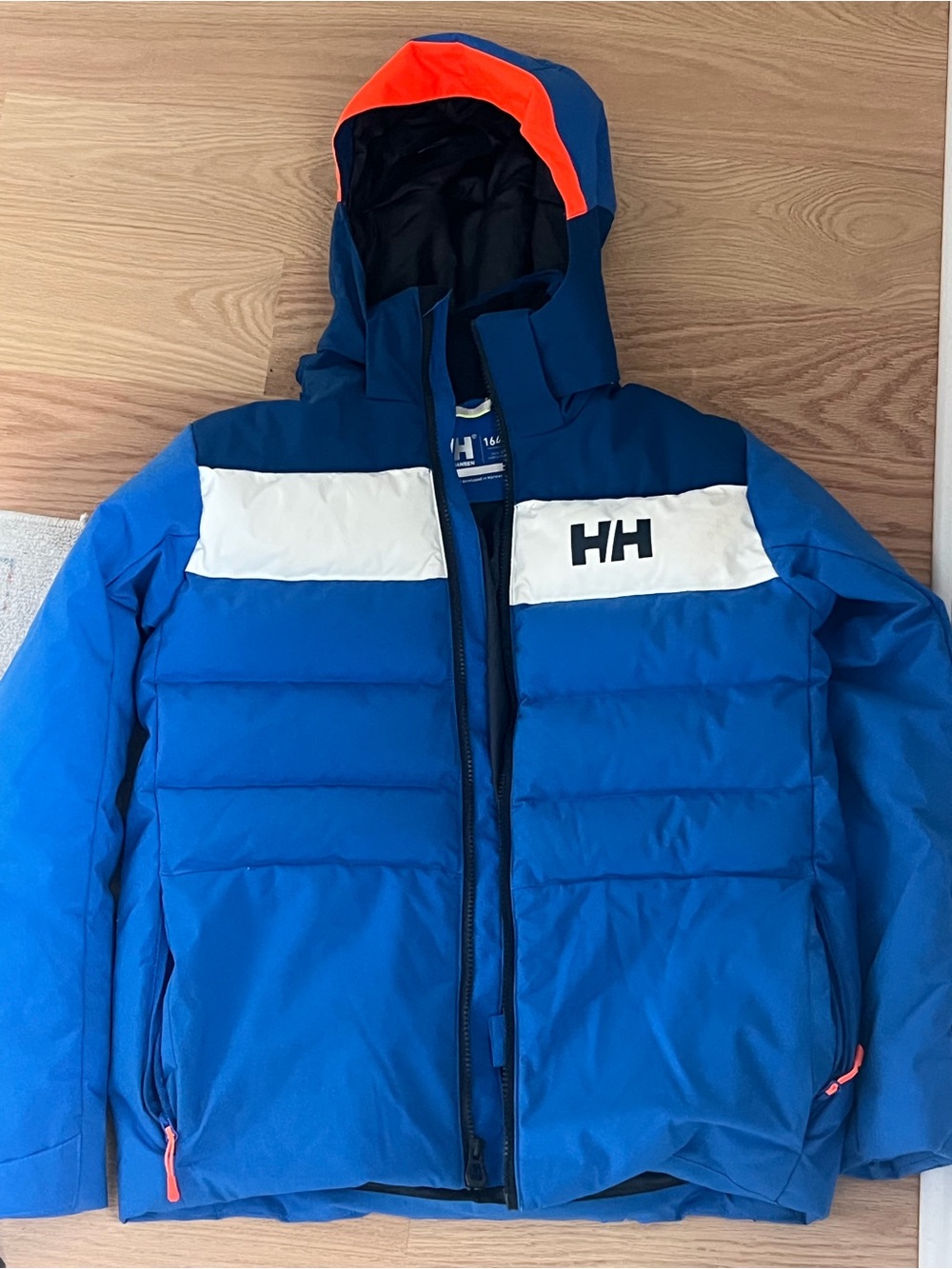 Helly Hansen boys Blue Ski Jacket with White  and Orange Hood Trim Size 14